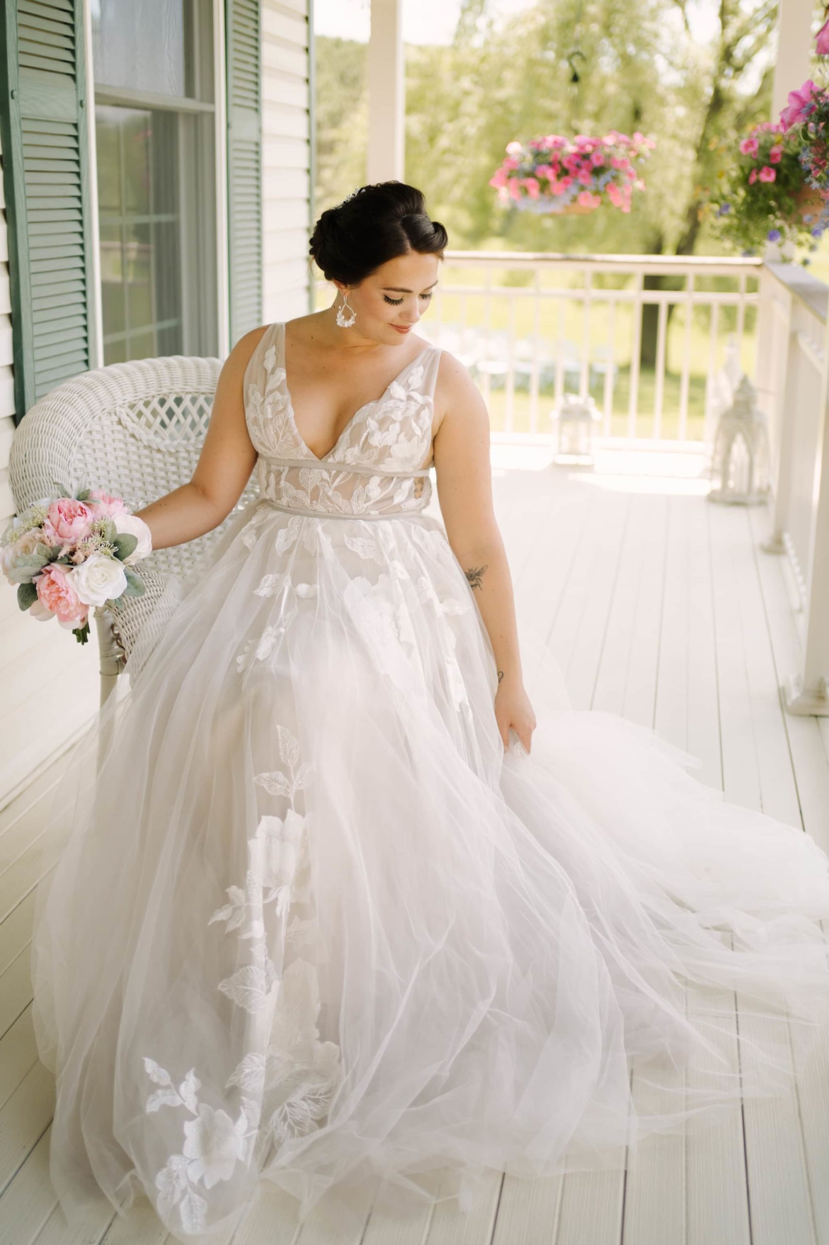 bride in flowing gauzy gown on homestead porch