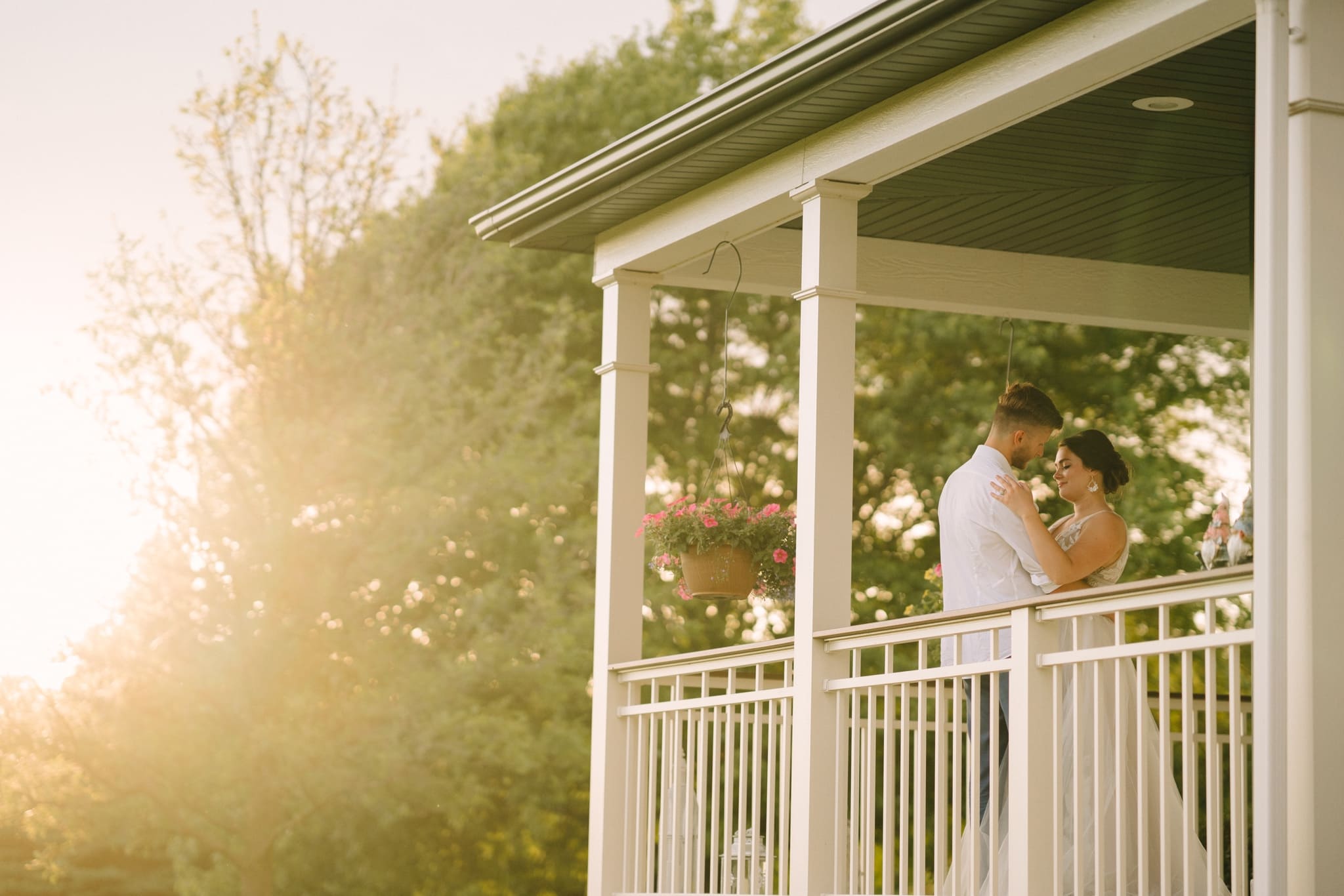newlyweds at sunset on homestead porch