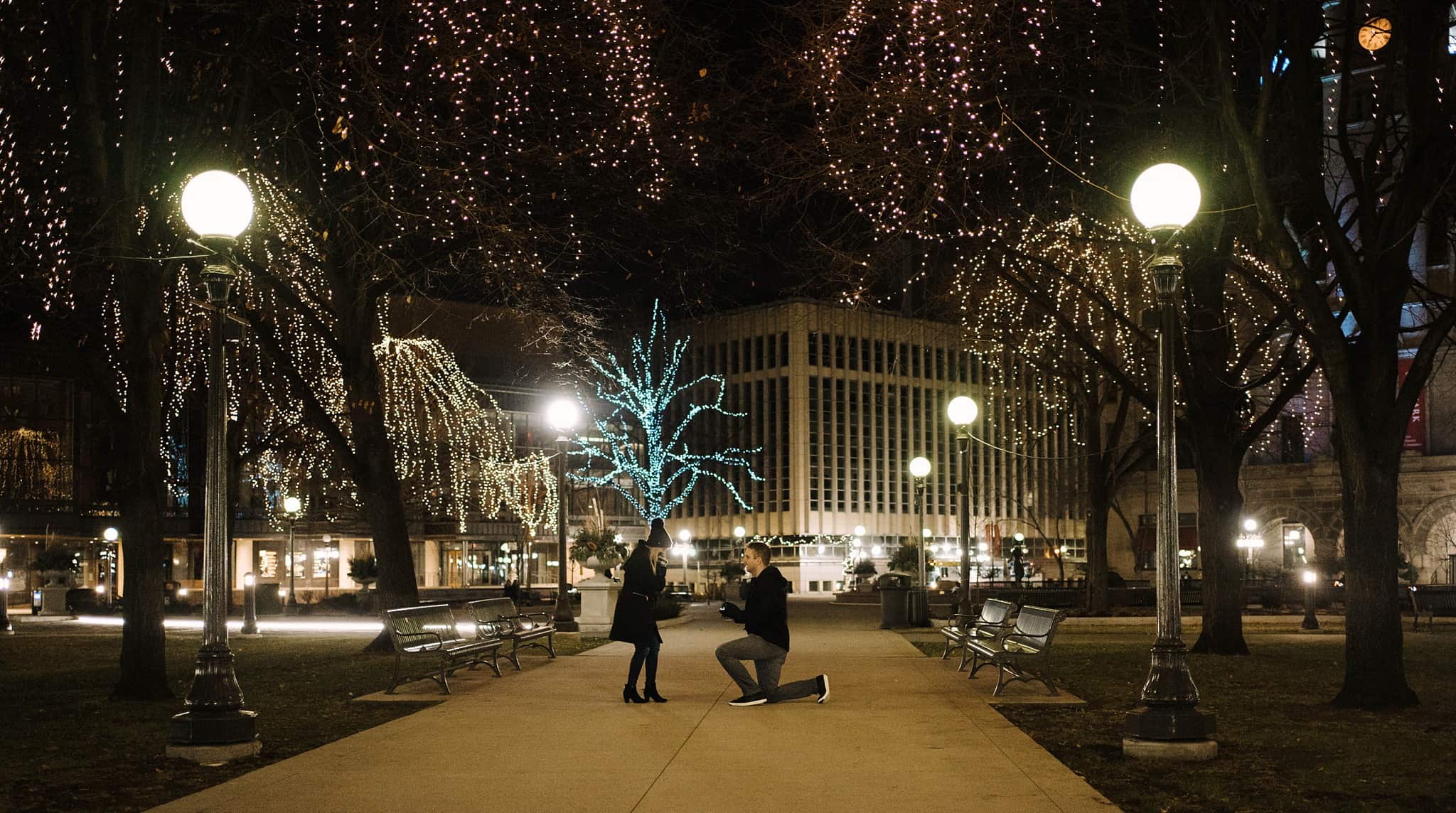 surprise proposal with winter lights