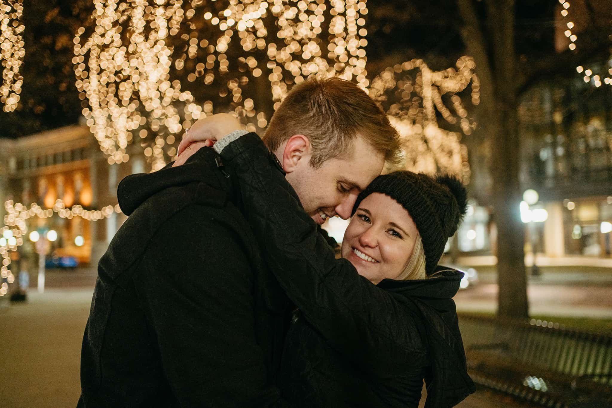 winter surprise proposal with twinkle lights