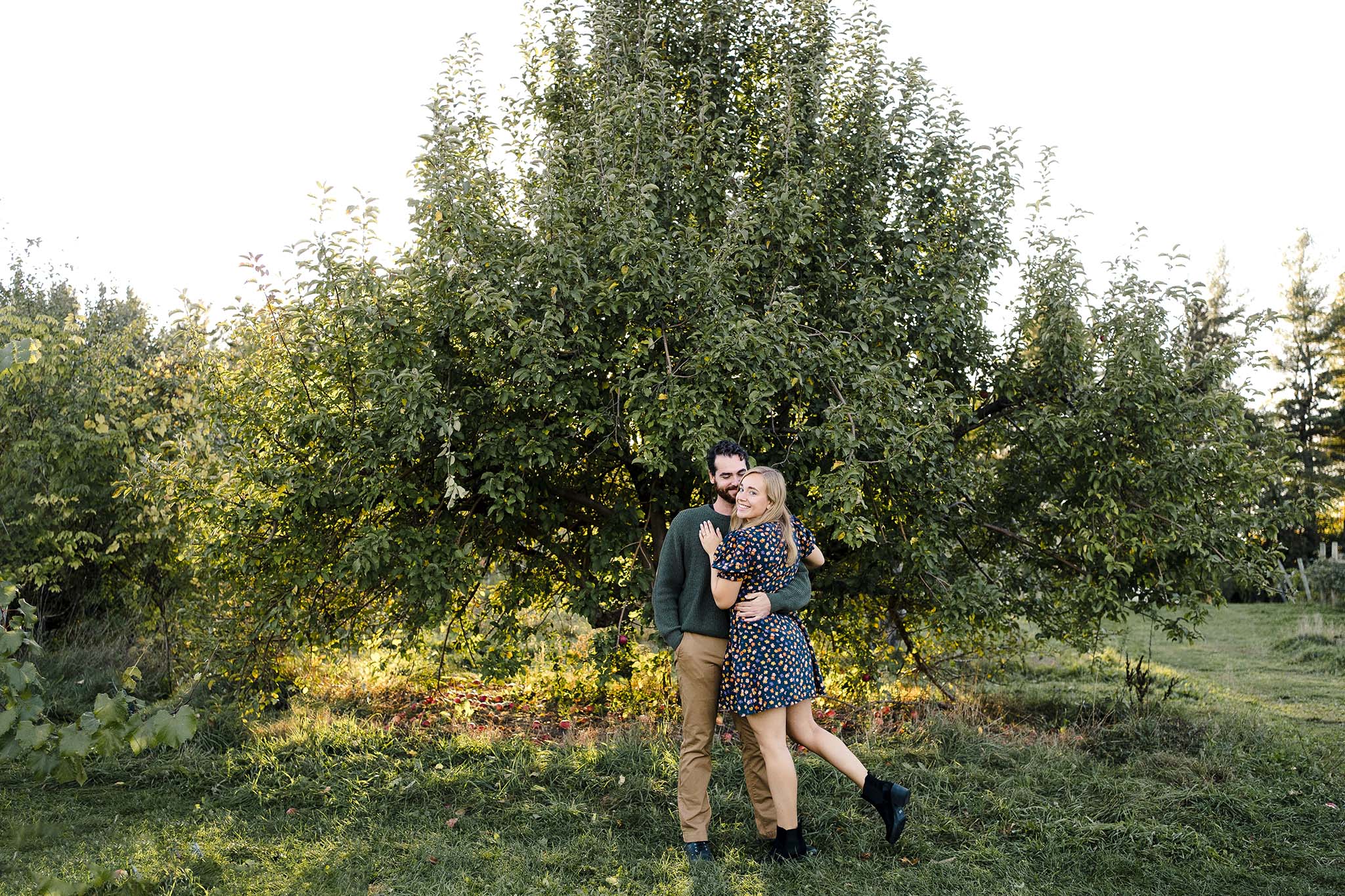 Couple hugging. for their apple orchard photo session