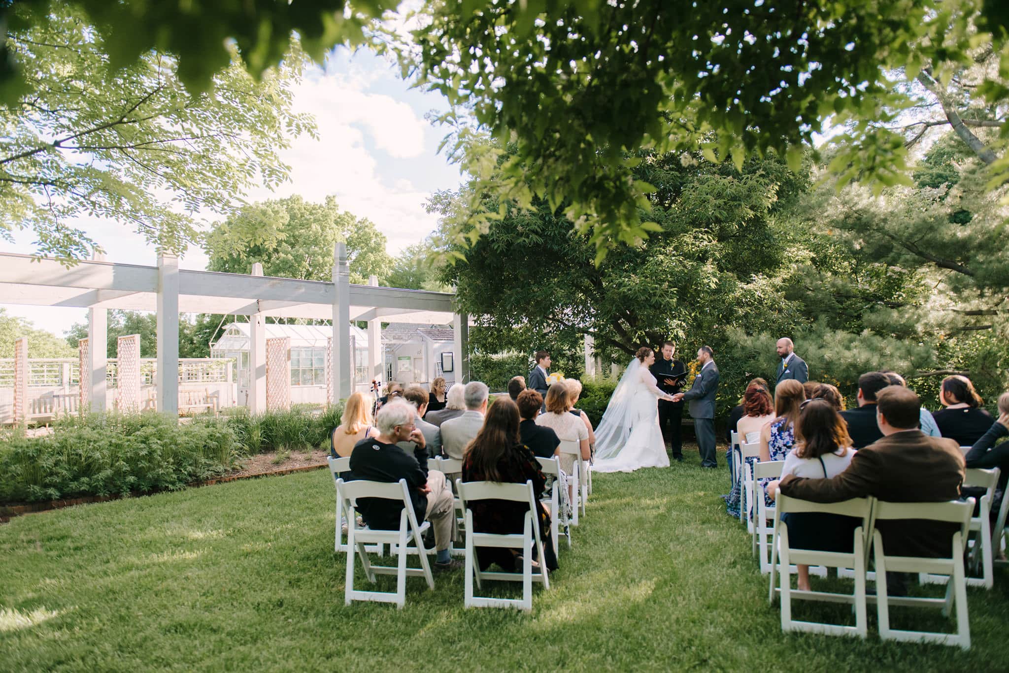 Wedding ceremony at the Minnesota Arboretum gardens with chairs outdoors