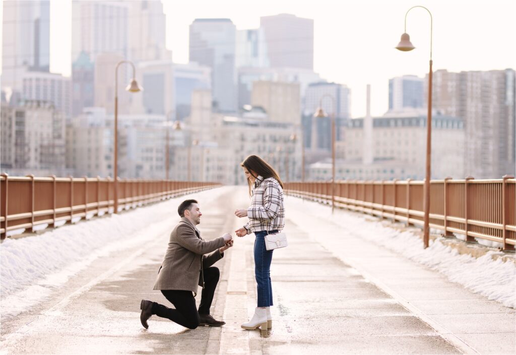 a marriage proposal on a bridge in a city in Minnesota